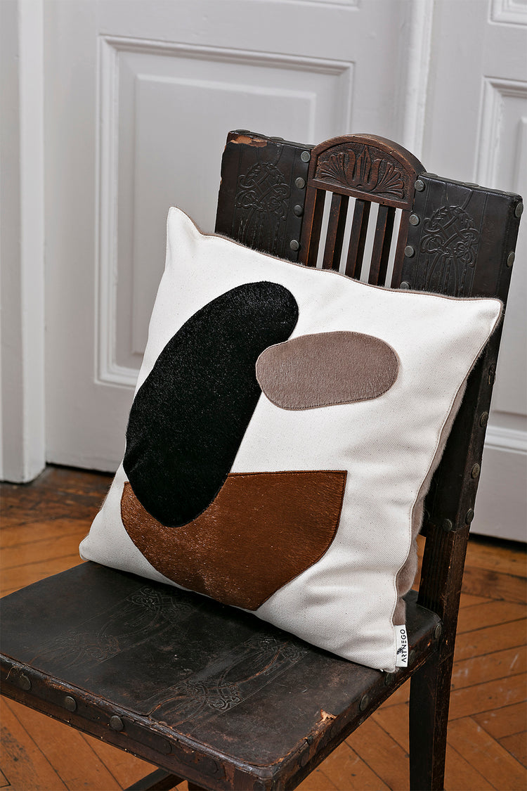 minimalist interior design pillow cover Memento on a wodden chair